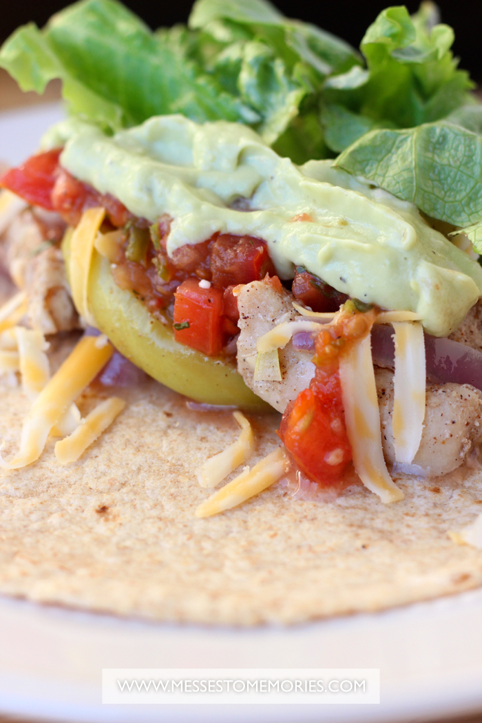 Chicken and Apple Tacos on a white plate close up.