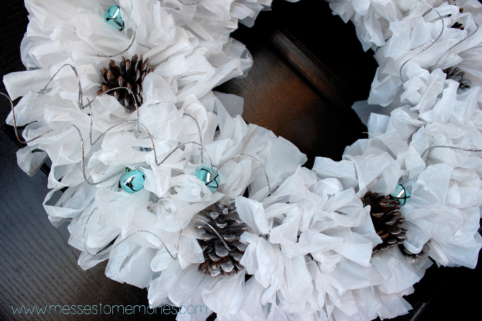 Upcycled Winter Wreath made with plastic bags, bells and pinecones from Messes to Memories